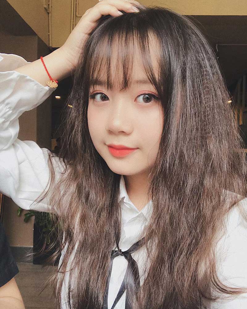 Kiểu tóc ngang lưng dập xù